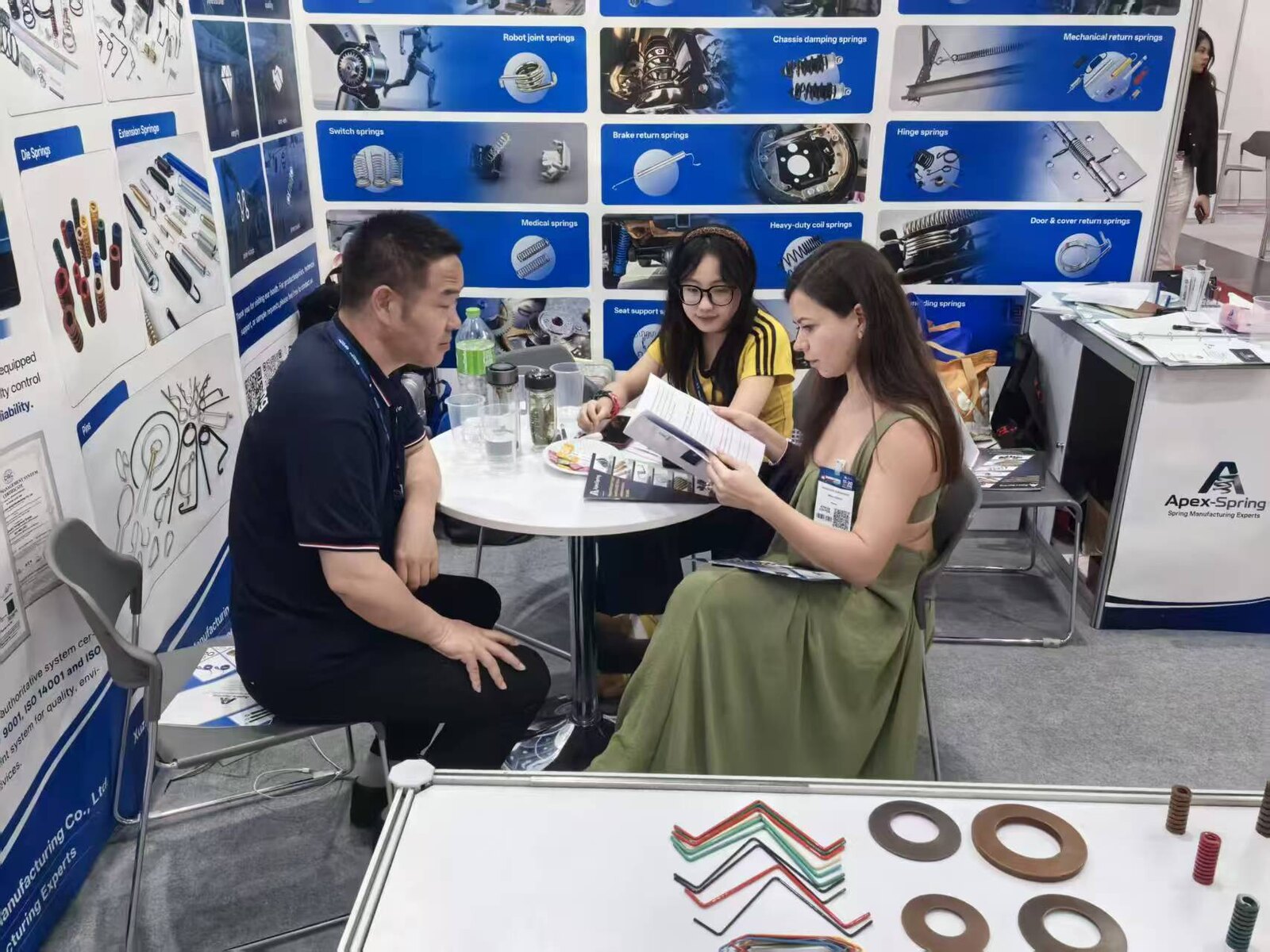 Visitors meeting with the NorenSpring team at the exhibition booth
