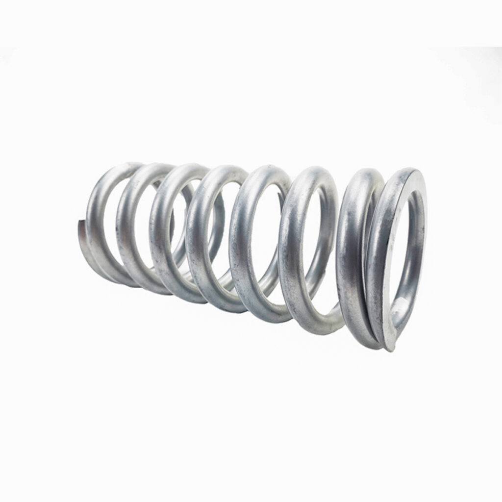 Zinc-plated compression springs on a white background.