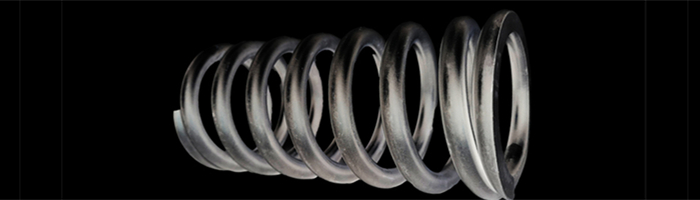 Close-up of large coil spring turns.
