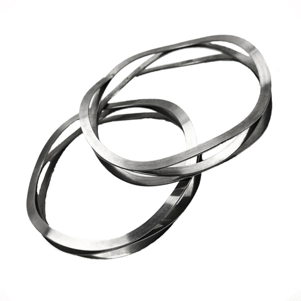 Stainless steel wave springs made from flat wire with several waves per turn.