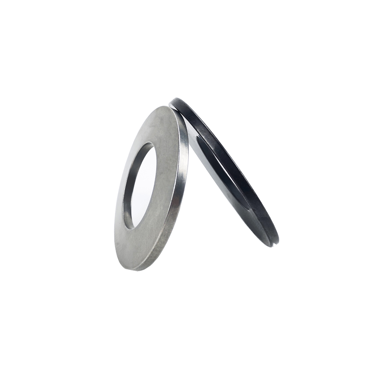 Two disc springs, one steel and one black, leaning together