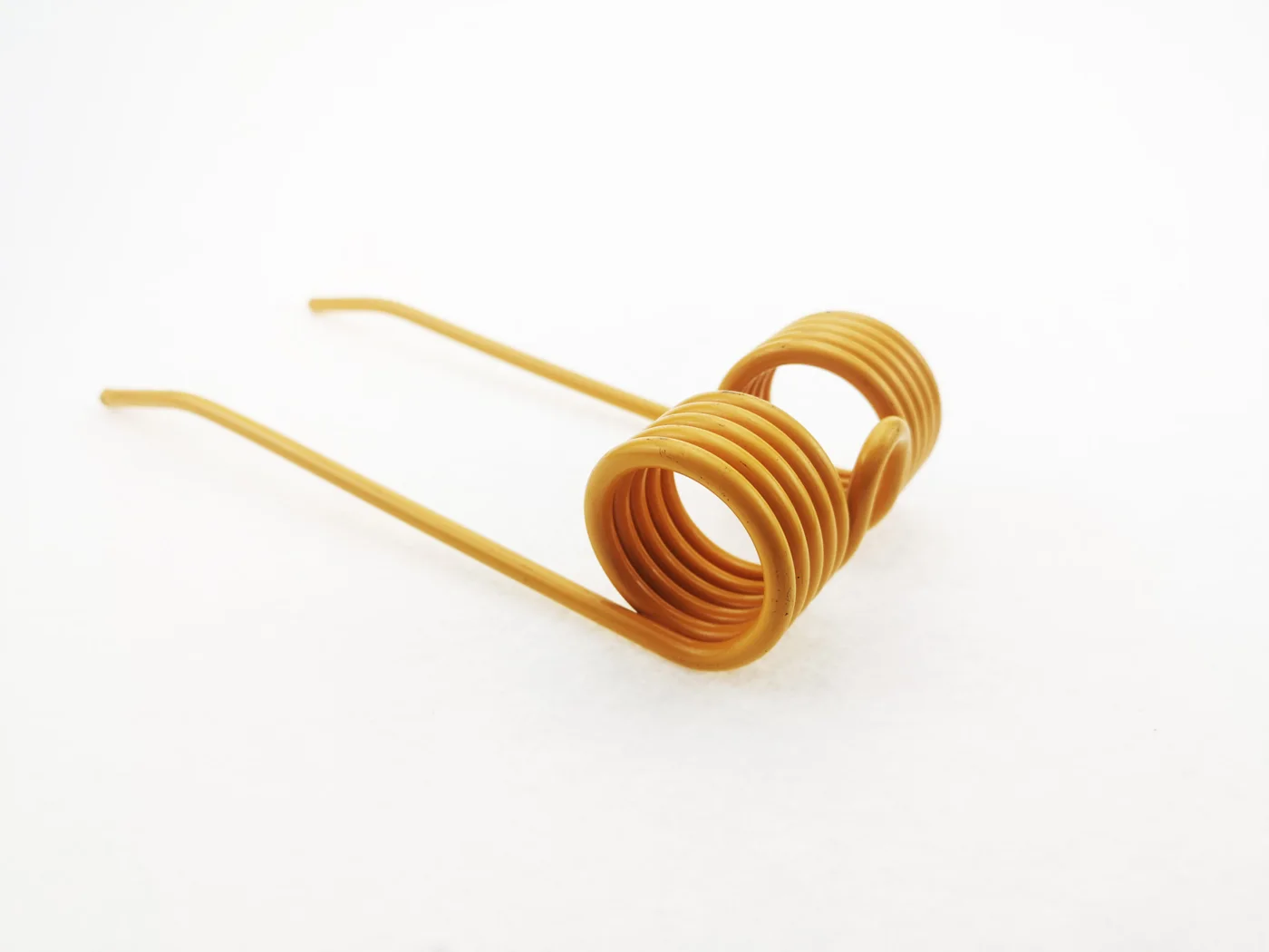 A yellow-coated double torsion spring tine with two coil stacks, a mounting loop between them and two straight teeth