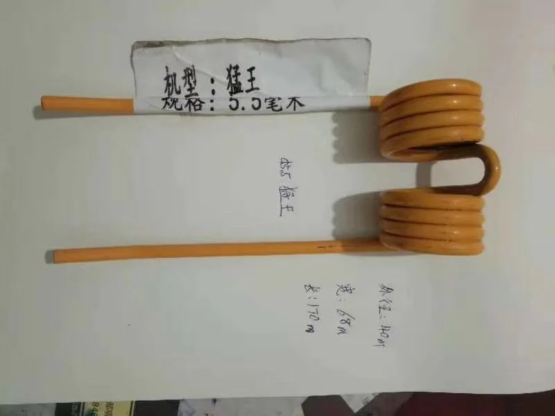 A yellow-coated double torsion tine on paper, tagged with its wire size, with handwritten measurements for outside diameter 40 mm, width 68 mm and length 170 mm