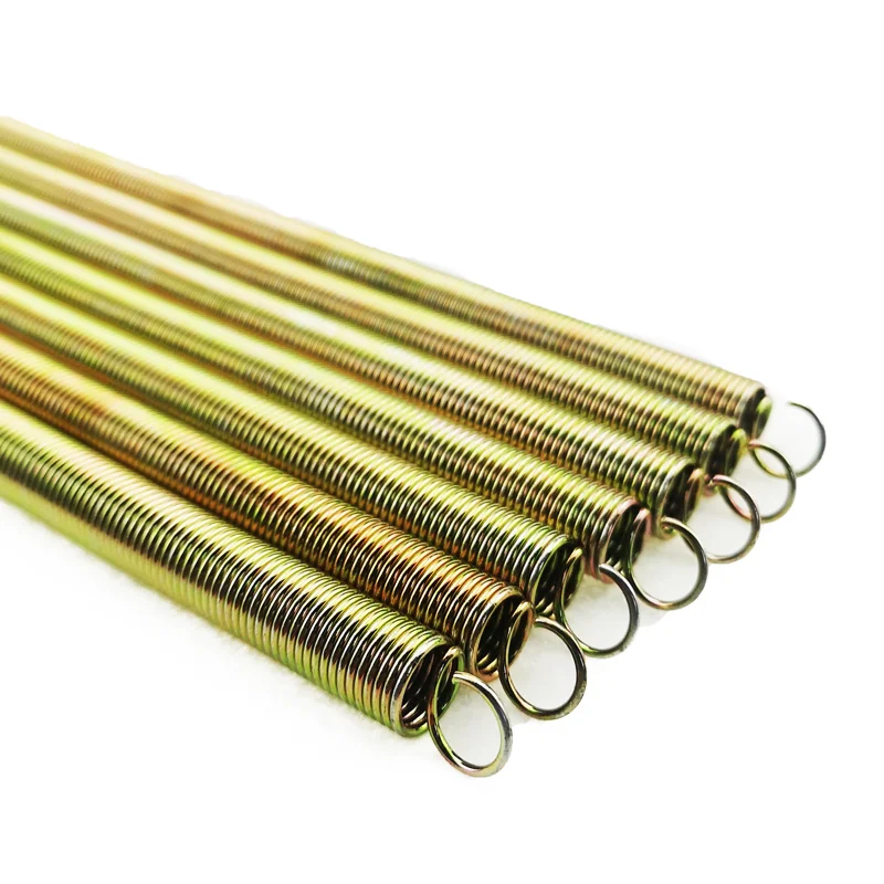 Bundle of yellow zinc plated extension springs with round loop ends on a white background